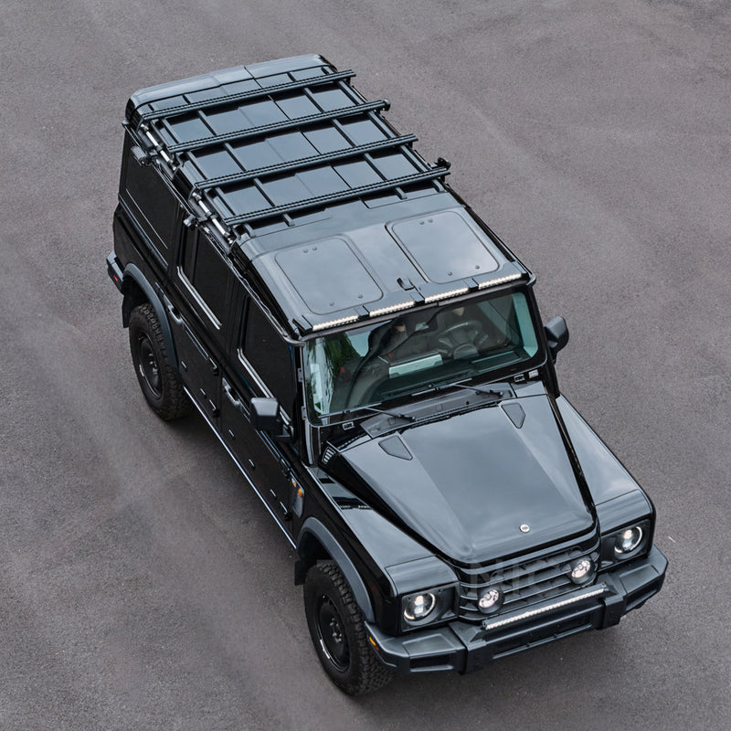 INEOS Grenadier Wagon fitted with four DualTrack-T MAX roof rails and a full-length cargo platform, overhead view