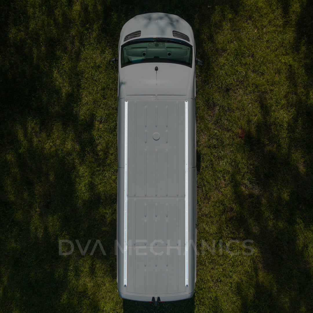 Top-down aerial of a Mercedes Sprinter with two LoadSpan roof rails running the full length of the roof