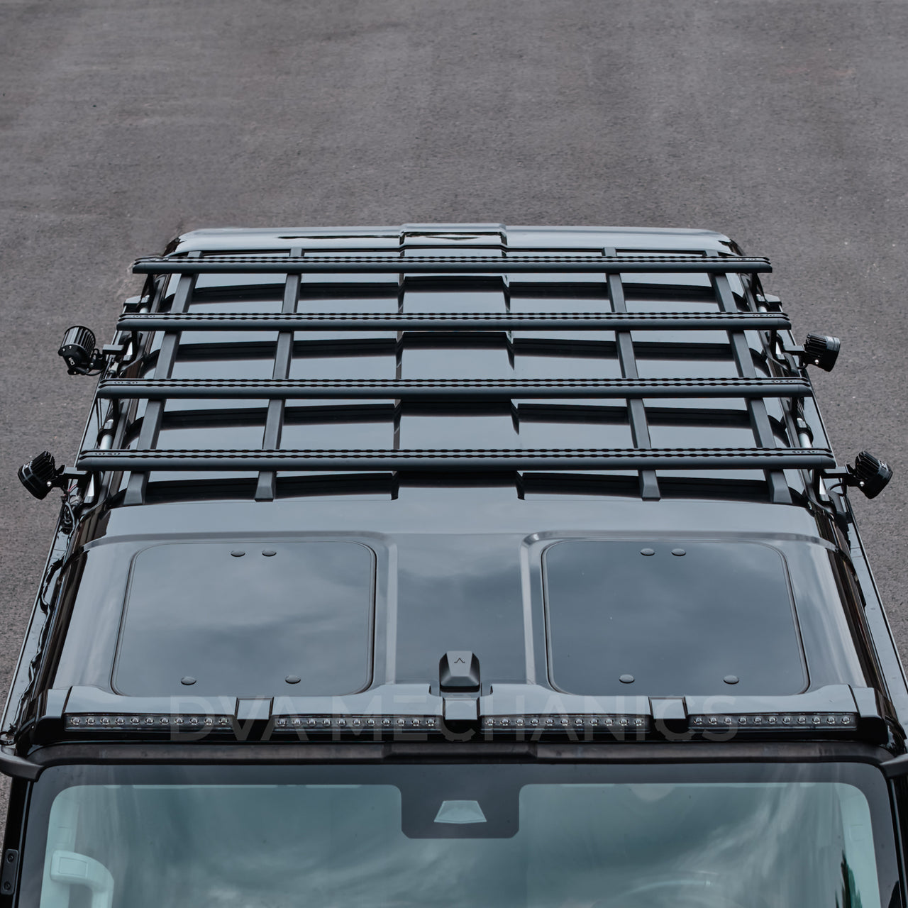 Front three-quarter overhead view of an INEOS Grenadier with a platform mounted on DualTrack-T MAX rails