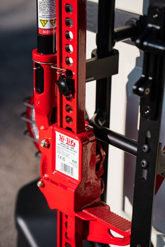 Rear ladder-mounted Hi-Lift jack carrier for INEOS Grenadier by DVA Mechanics – rugged off-road accessory
