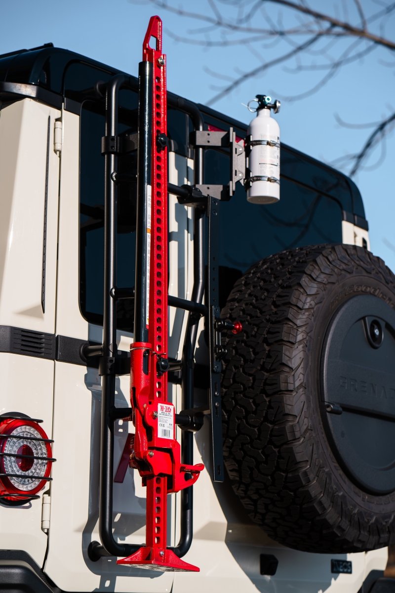 Rear ladder-mounted Hi-Lift jack carrier for INEOS Grenadier by DVA Mechanics – rugged off-road accessory