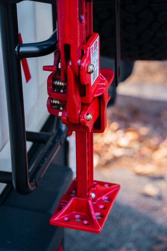 Rear ladder-mounted Hi-Lift jack carrier for INEOS Grenadier by DVA Mechanics – rugged off-road accessory
