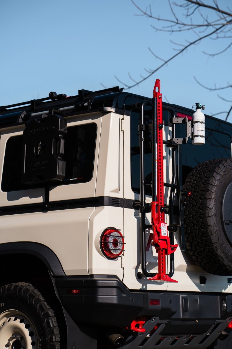 Rear ladder-mounted Hi-Lift jack carrier for INEOS Grenadier by DVA Mechanics – rugged off-road accessory